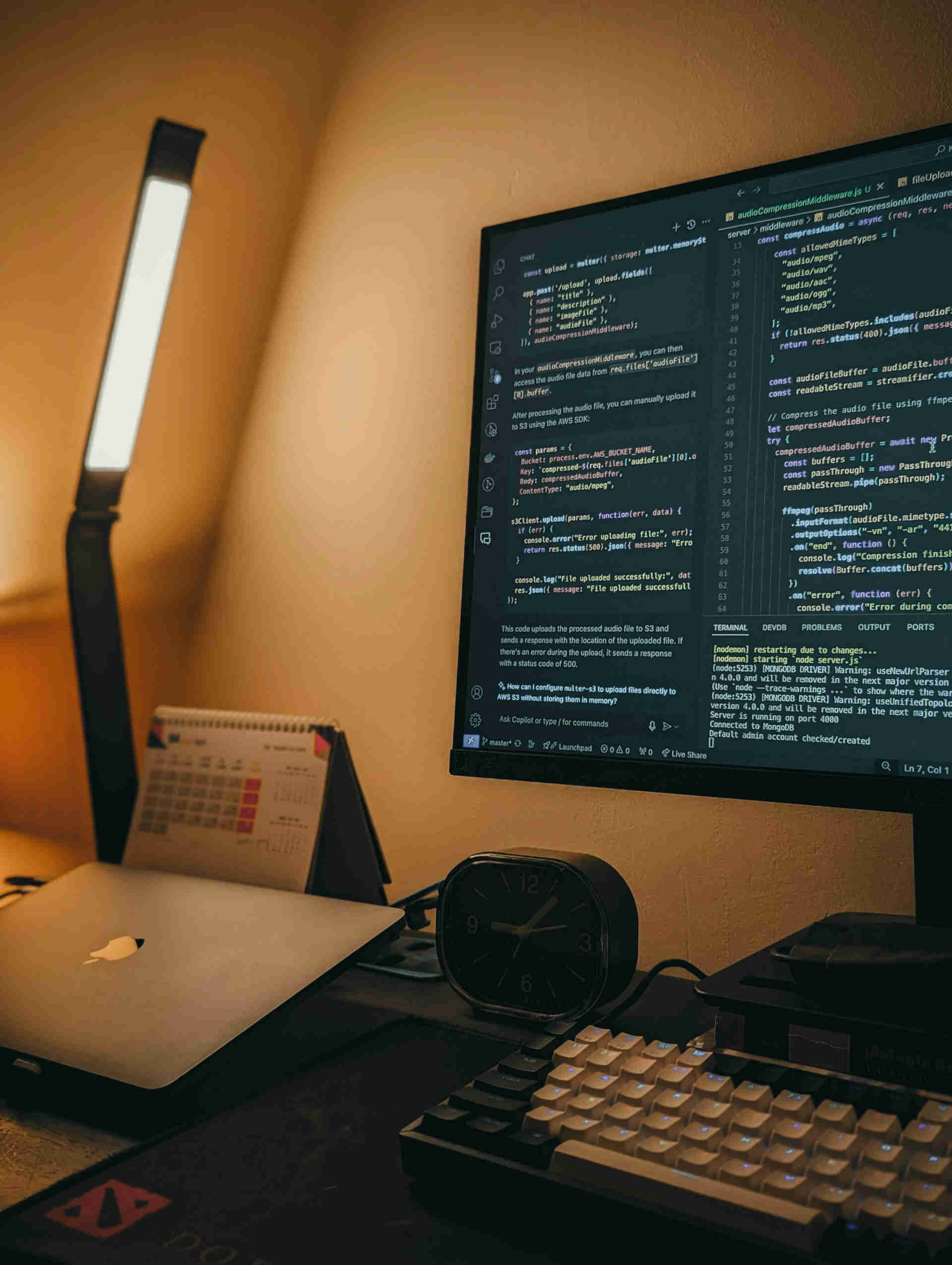 A computer sitting on top of a work desk, showing programming code for a website.